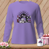 Purple long-sleeve shirt with a sewing machine, dog, wine, and yarn graphic.