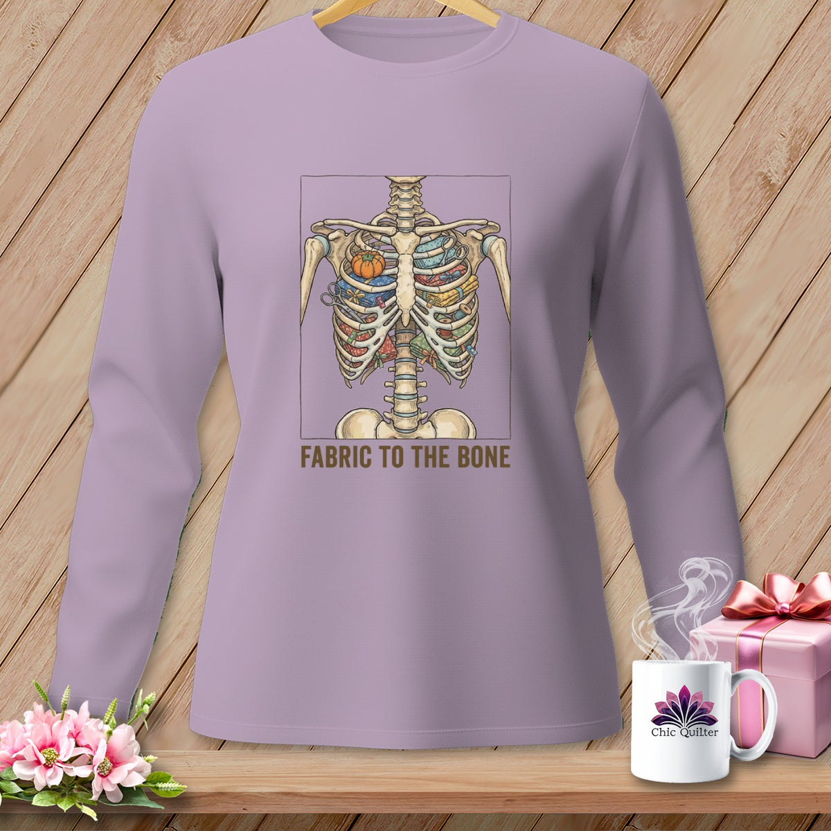 Long sleeve shirt with skeleton ribcage filled with fabric, reads "Fabric to the Bone".