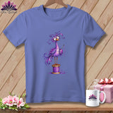 A purple t-shirt featuring a quirky purple bird standing on a spool of thread.