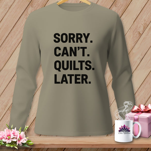 Taupe long-sleeve shirt with black text reading "SORRY. CAN'T. QUILTS. LATER."