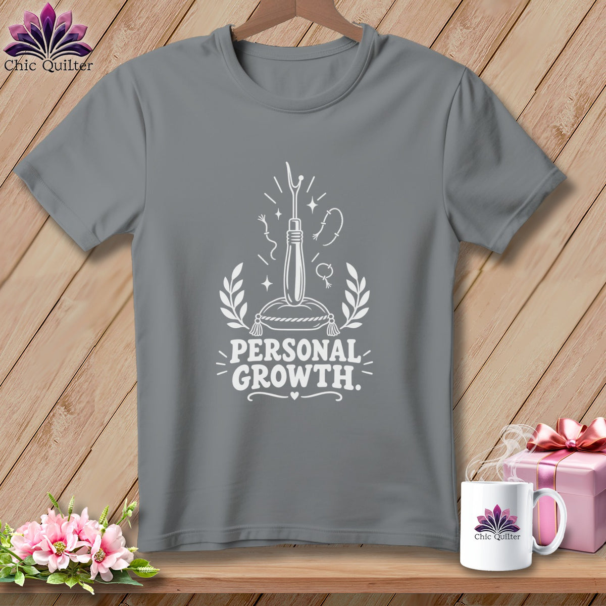 Gray t-shirt with "Personal Growth" text and sewing imagery.