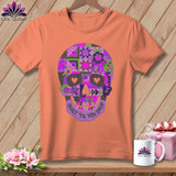 Peach t-shirt with a purple quilt-patterned skull graphic and 