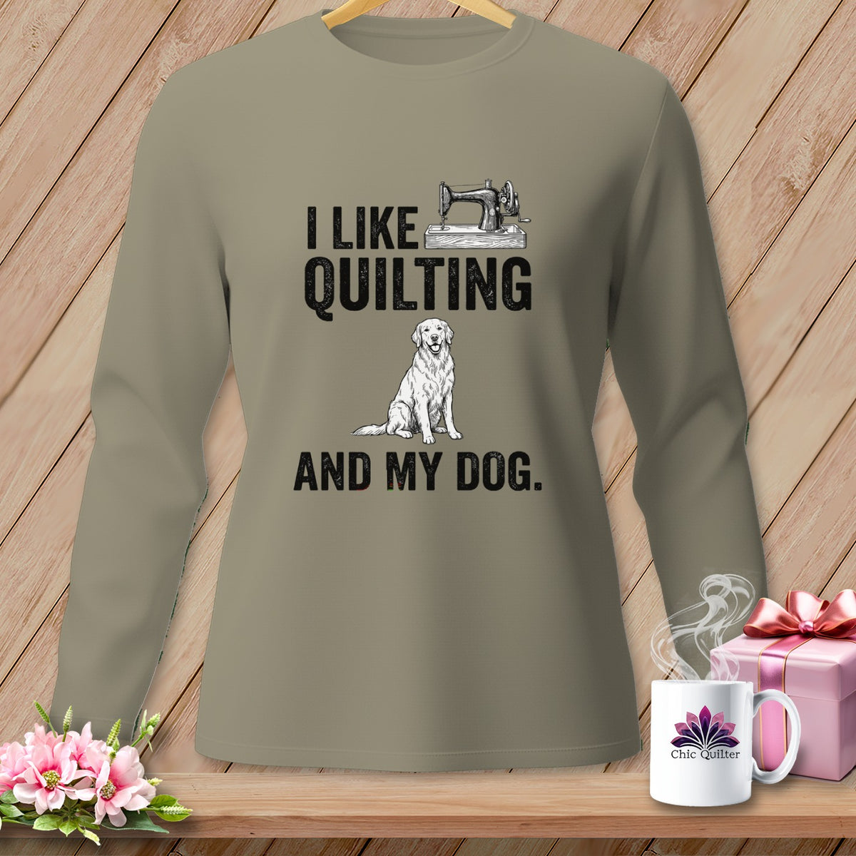 Long-sleeve shirt with "I like quilting and my dog" graphic and sewing machine.