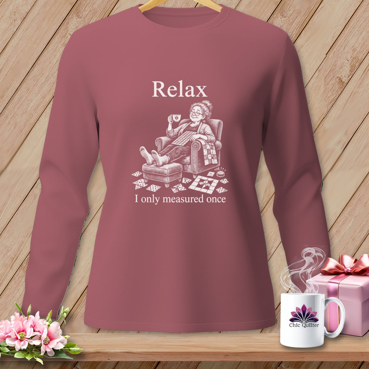 Long-sleeve shirt with "Relax, I only measured once" and a quilter illustration.
