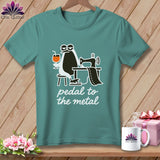 Teal t-shirt with a penguin using a sewing machine and text 