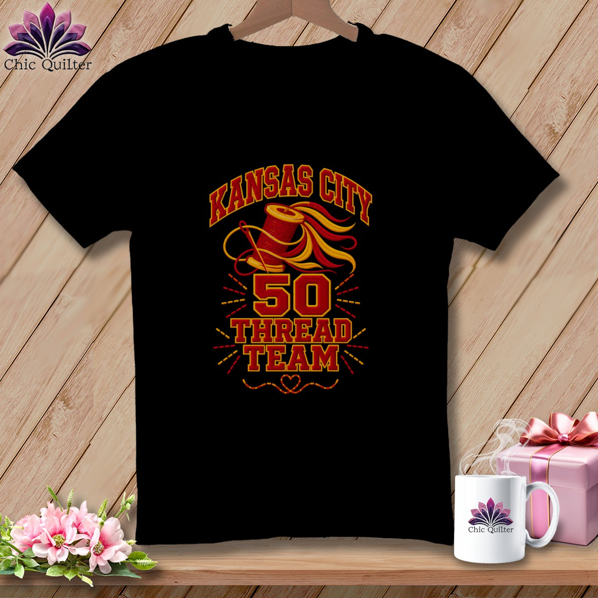 A black t-shirt hanging on a wooden background features a yellow and red design that reads "Kansas City 50 Thread Team".