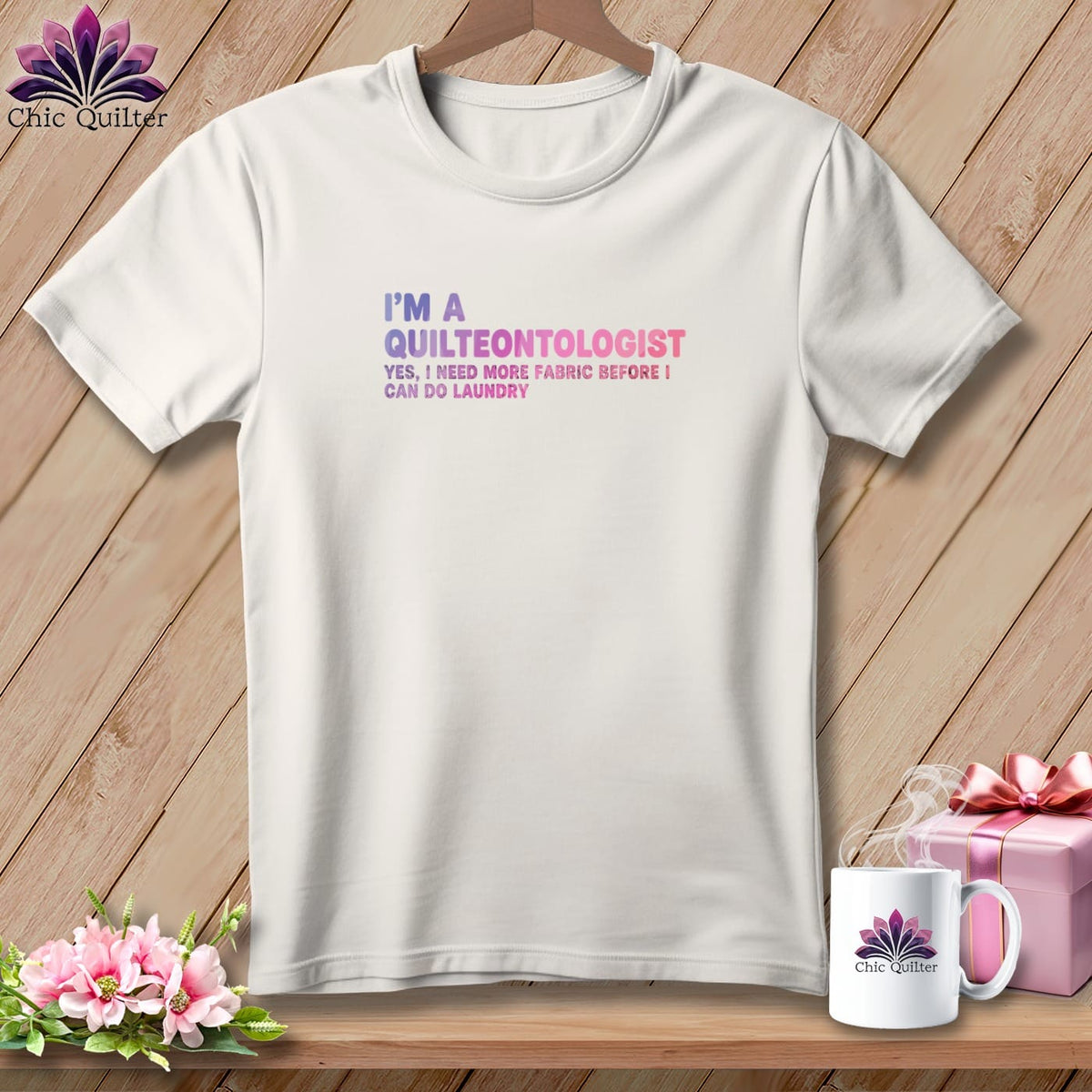 White t-shirt with "I'm a Quilteontologist" text and a humorous sewing quote.