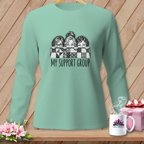 Mint green long-sleeve shirt with three women peeking over a quilt and text "MY SUPPORT GROUP".
