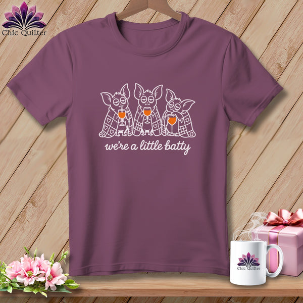 T-shirt with three cartoon bats holding wine glasses, saying "we're a little batty".