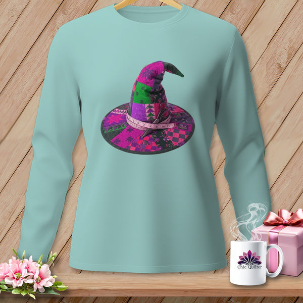 Teal long-sleeve shirt with a patchwork witch hat graphic and "Chic Quilter" mug.