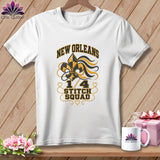 A white t-shirt features New Orleans 1/4 Stitch Squad graphics on a wooden background.