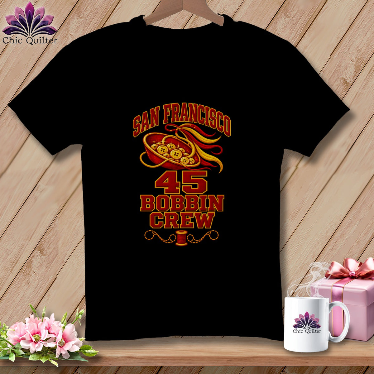 A black t-shirt features a graphic with the text San Francisco 45 Bobbin Crew, sewing buttons, and a spool of thread.