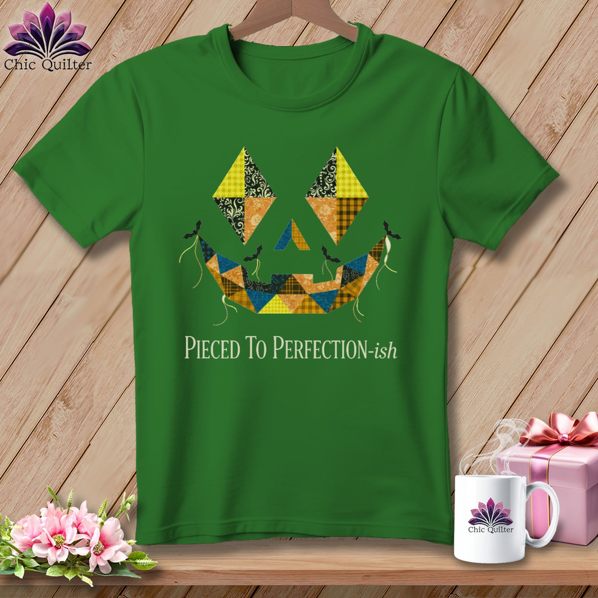 Green t-shirt with a patchwork jack-o'-lantern design and "Pieced To Perfection-ish" text.
