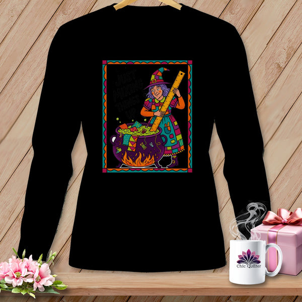 Witch with ruler stirring cauldron with sewing supplies, text "Just Mixing Things Up".