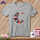 Grey t-shirt with a patchwork crescent moon, witch, and spool of thread embroidery.