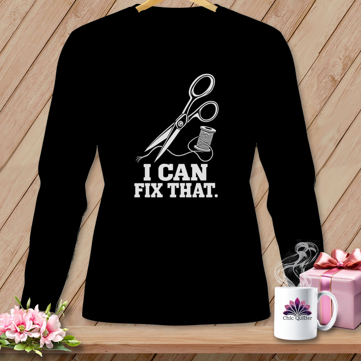 Black long sleeve shirt with scissors, thread, and text "I CAN FIX THAT."