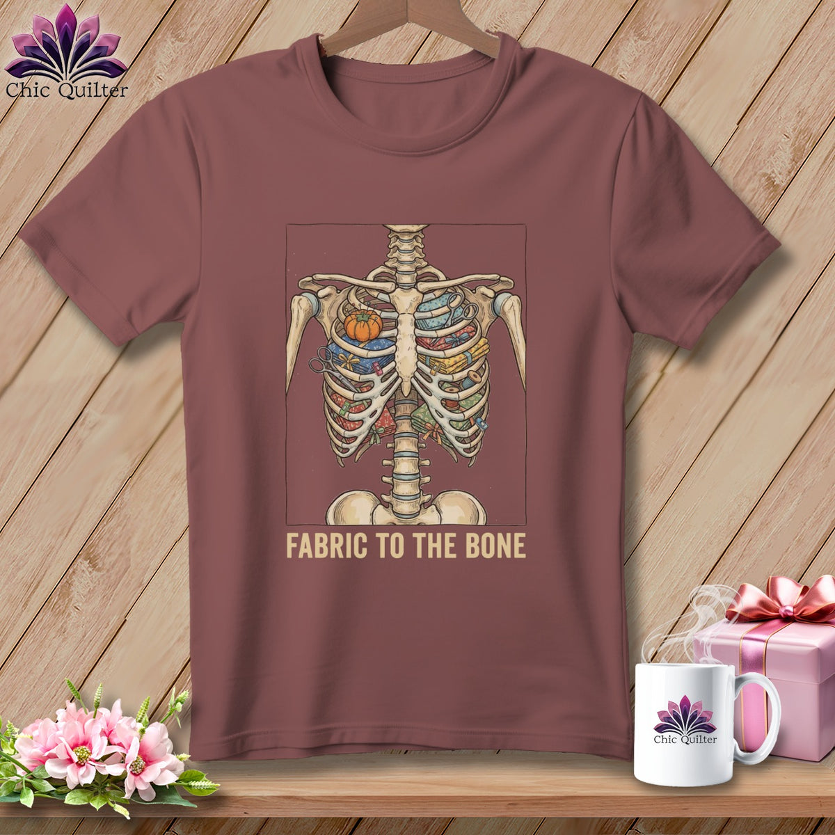 Skeleton ribcage filled with fabric and sewing notions, text "FABRIC TO THE BONE".