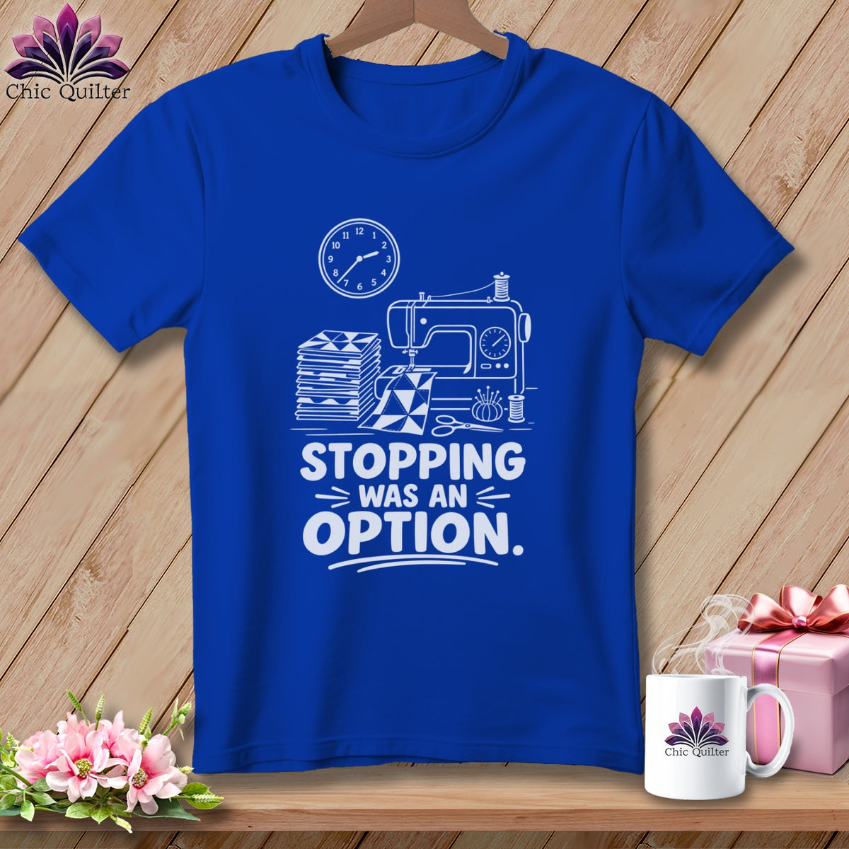Royal blue t-shirt with white graphic of sewing machine and text "STOPPING WAS AN OPTION."