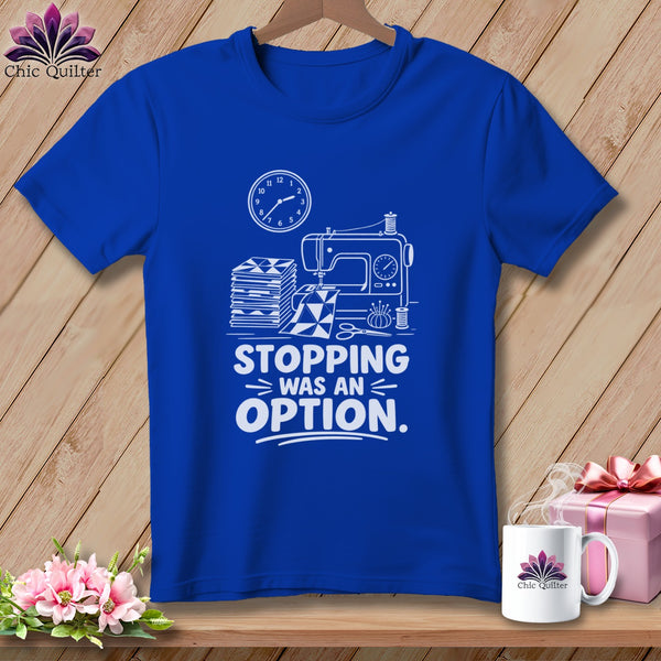 Royal blue t-shirt with white graphic of sewing machine and text "STOPPING WAS AN OPTION."