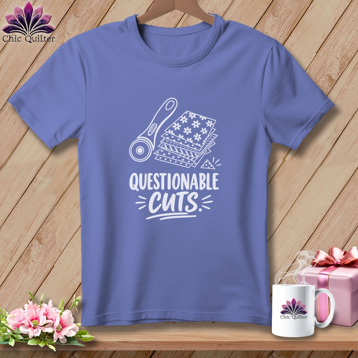 Purple t-shirt with rotary cutter, fabric stack, and "Questionable Cuts" text.