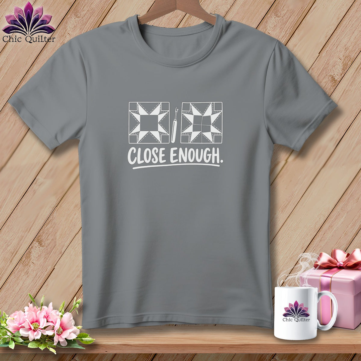 Gray t-shirt with white quilting designs and "CLOSE ENOUGH." text.