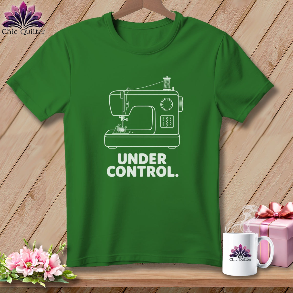 Green t-shirt with white sewing machine graphic and text "UNDER CONTROL."