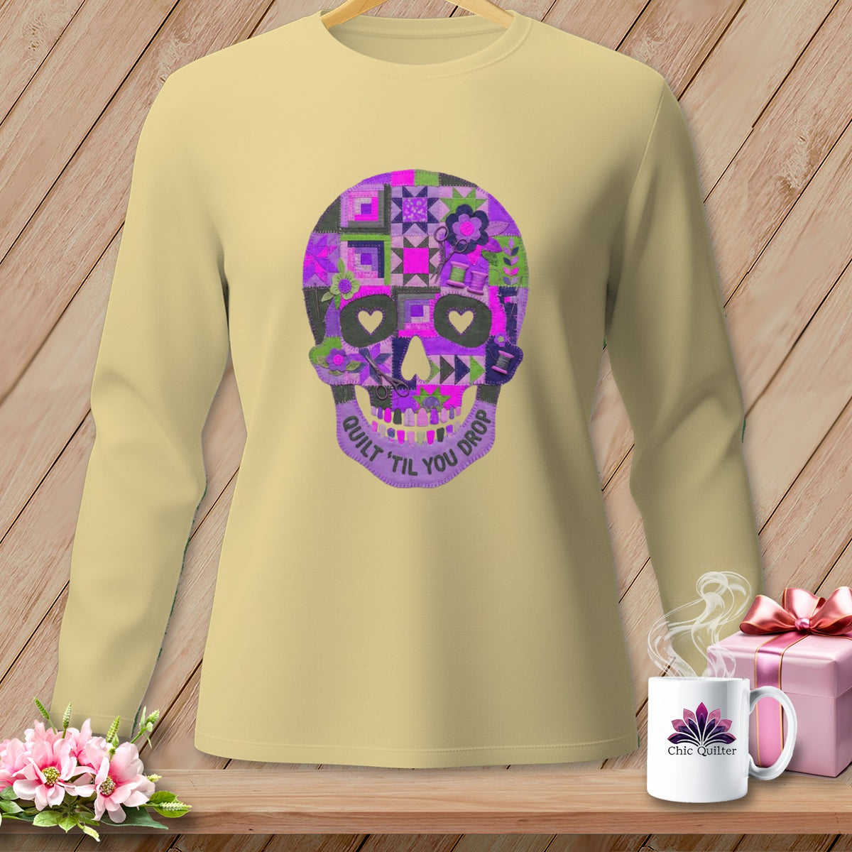Light yellow long-sleeve shirt with a quilted skull graphic saying "Quilt 'Til You Drop."
