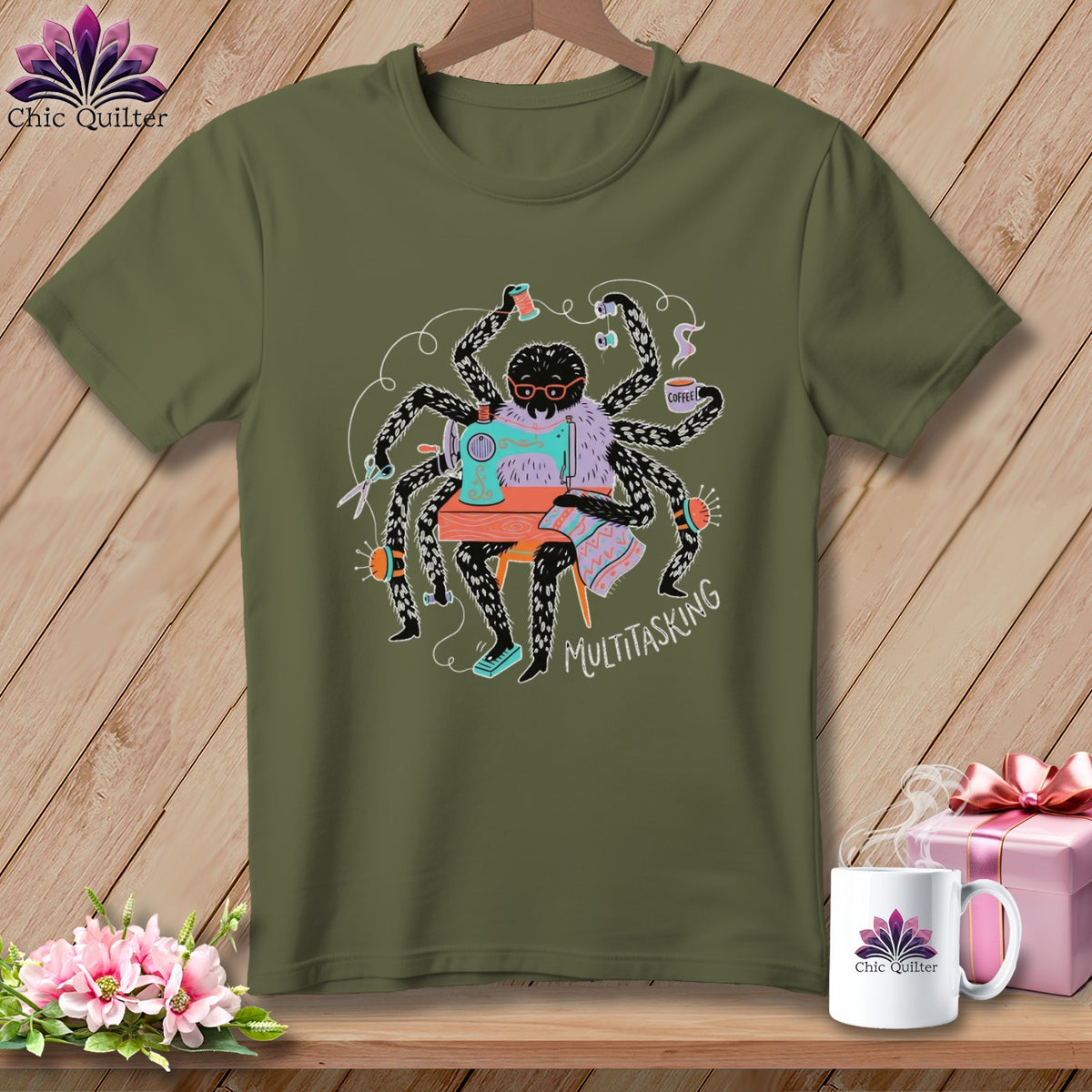 Green t-shirt with a cartoon spider sewing and drinking coffee, text says MULTITASKING.