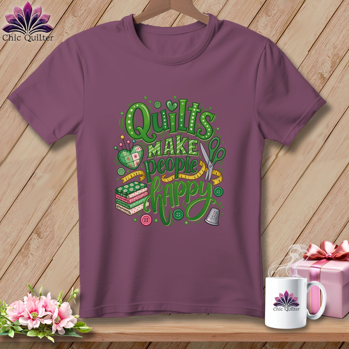 Plum t-shirt featuring green "Quilts make people happy" typography, stacked fabrics, and sewing motifs.