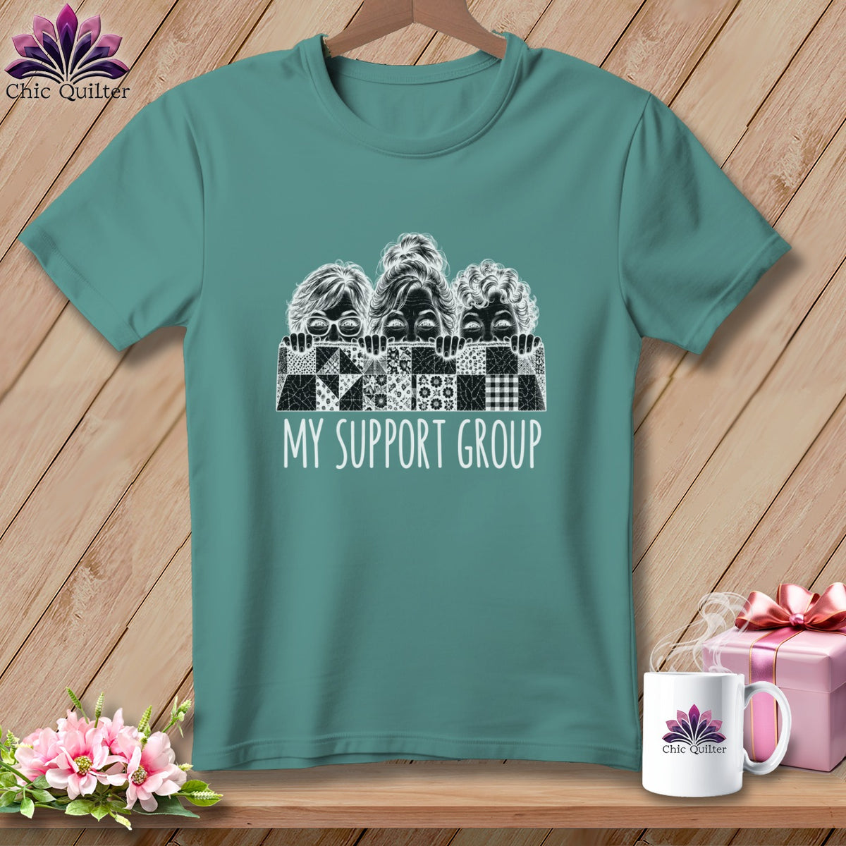 Teal t-shirt with "My Support Group" and sketched faces peeking over quilt squares.
