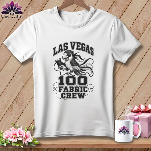 A white crewneck t-shirt featuring a cartoon bird graphic with text reading Las Vegas 100 Fabric Crew.