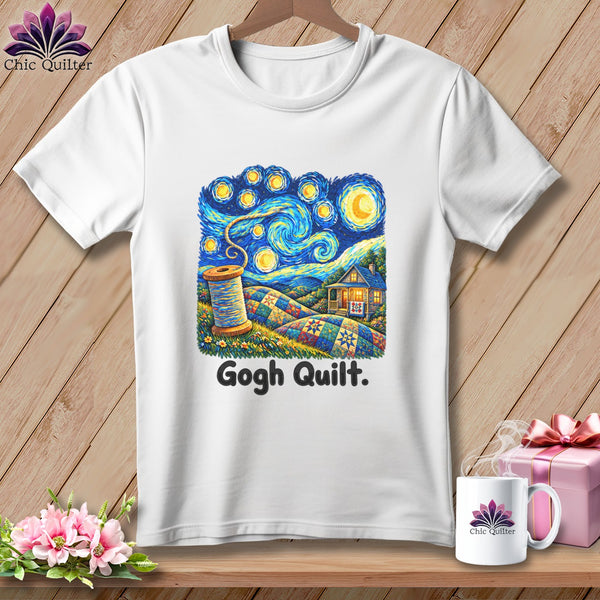 White t-shirt featuring a quilt scene under a starry sky with text "Gogh Quilt.".
