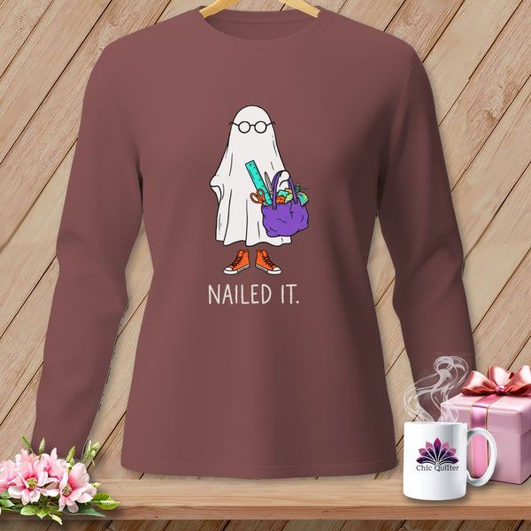 Ghost with glasses holding a purple bag with crafts and "NAILED IT." text.