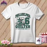 A white t-shirt features green lettering that reads Philadelphia Quilter Stitch Six alongside a quilt block graphic and the number 6.