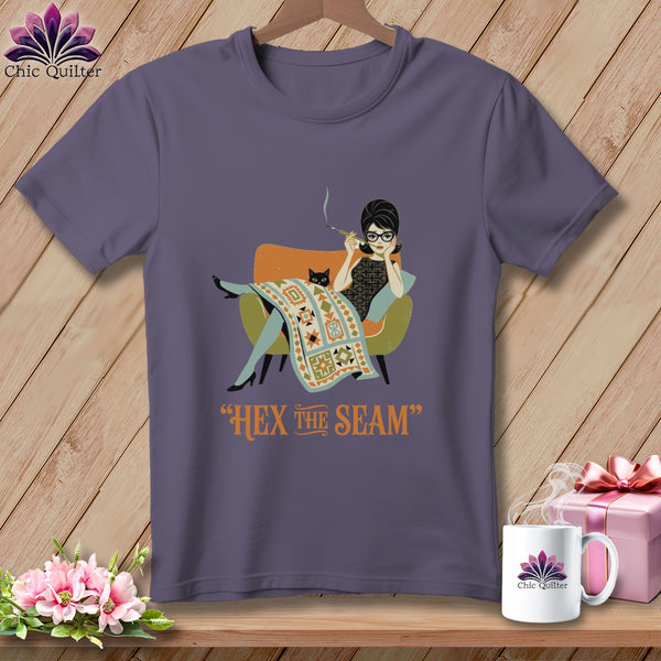 T-shirt with a woman and cat sitting in a chair, text "Hex the Seam".