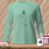 Mint green long-sleeve shirt with a needle and thread graphic.