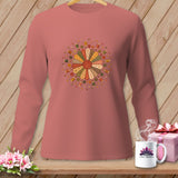 Pink long-sleeved shirt with a circular patchwork quilt and sewing notions design.