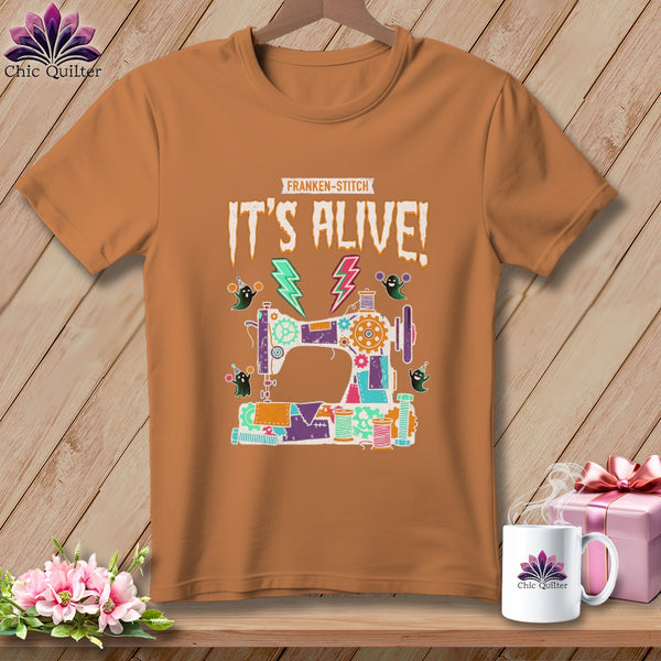Brown t-shirt with "Franken-Stitch" and "It's Alive!" text and a sewing machine graphic.