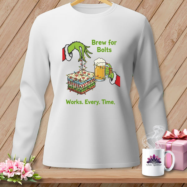 White long-sleeve shirt with Grinch-like hands, fabric bolts, beer, and text.