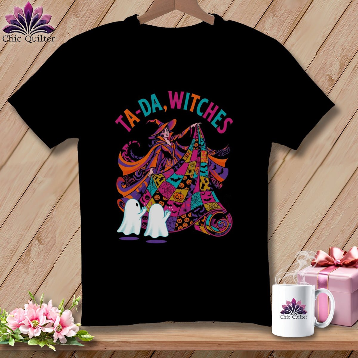 Black t-shirt with Halloween witch, ghosts, pumpkins, and text "Ta-Da, Witches".