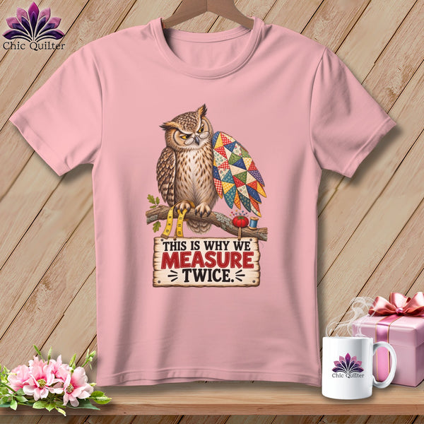 Pink t-shirt with an owl wearing glasses and holding a patchwork wing, with text.