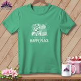 Green t-shirt with stacked folded quilts and 