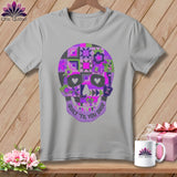 Gray t-shirt with purple patchwork skull design and text.
