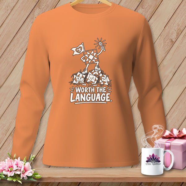 Orange long-sleeve shirt with a quilt square character and "Worth The Language" text.