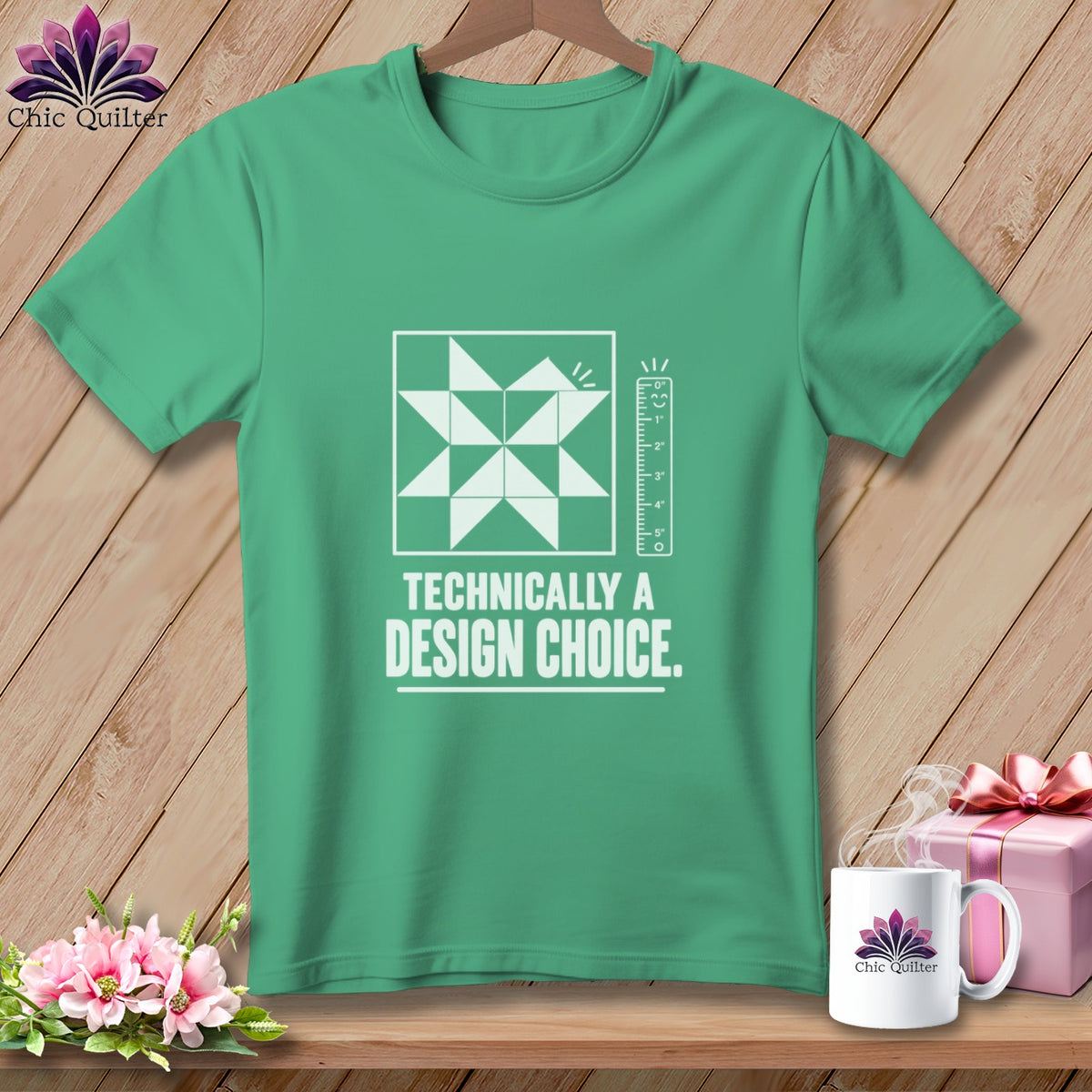 Green t-shirt with quilt block, ruler, and text "Technically a Design Choice."