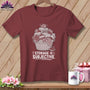 Maroon t-shirt with a white graphic of a basket overflowing with fabric. Text reads "STORAGE IS SUBJECTIVE."
