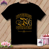 Black t-shirt featuring a yellow and black graphic with the text Pittsburgh Quilter, a spool of thread, and a needle.