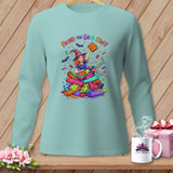 Light blue long-sleeve shirt with cartoon witch and Halloween fabric rolls.