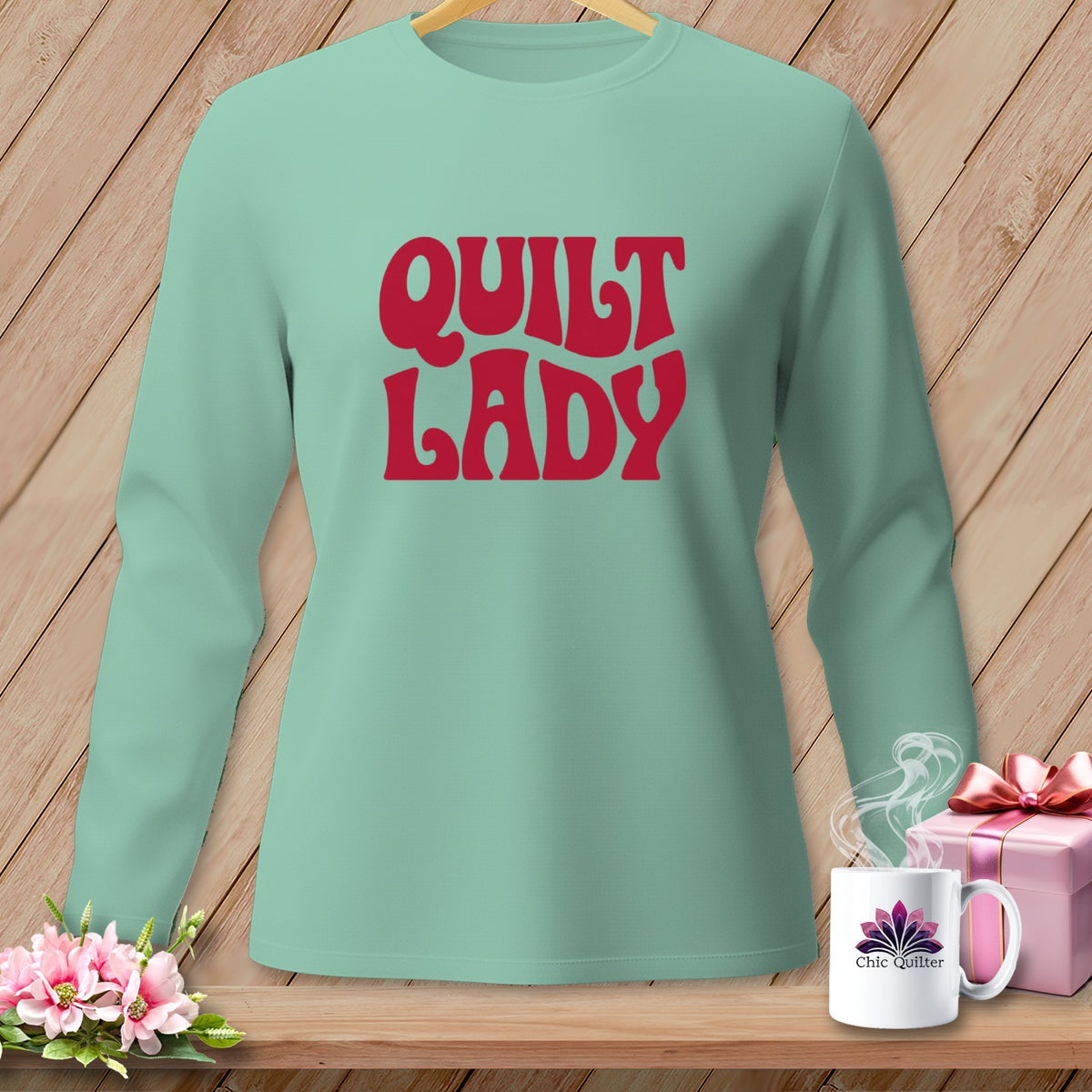 Light teal long-sleeve shirt with red "Quilt Lady" text.