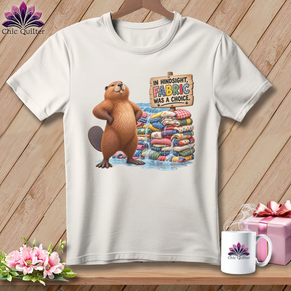 Beaver standing by stacked fabric and water with sign "Fabric was a choice."